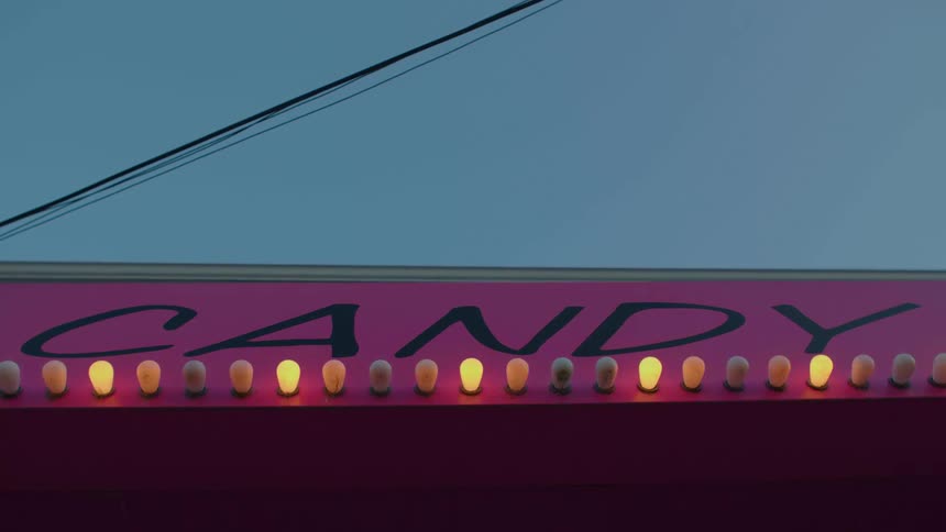 Lights flash on a sign on a business