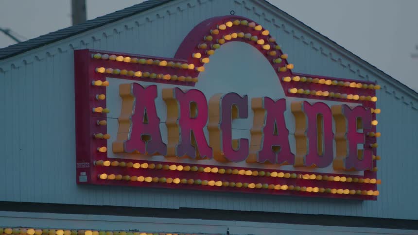 A view of a sign on an arcade building