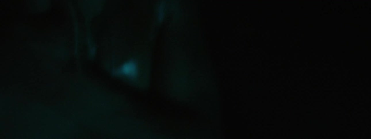 A man with no shirt on outside