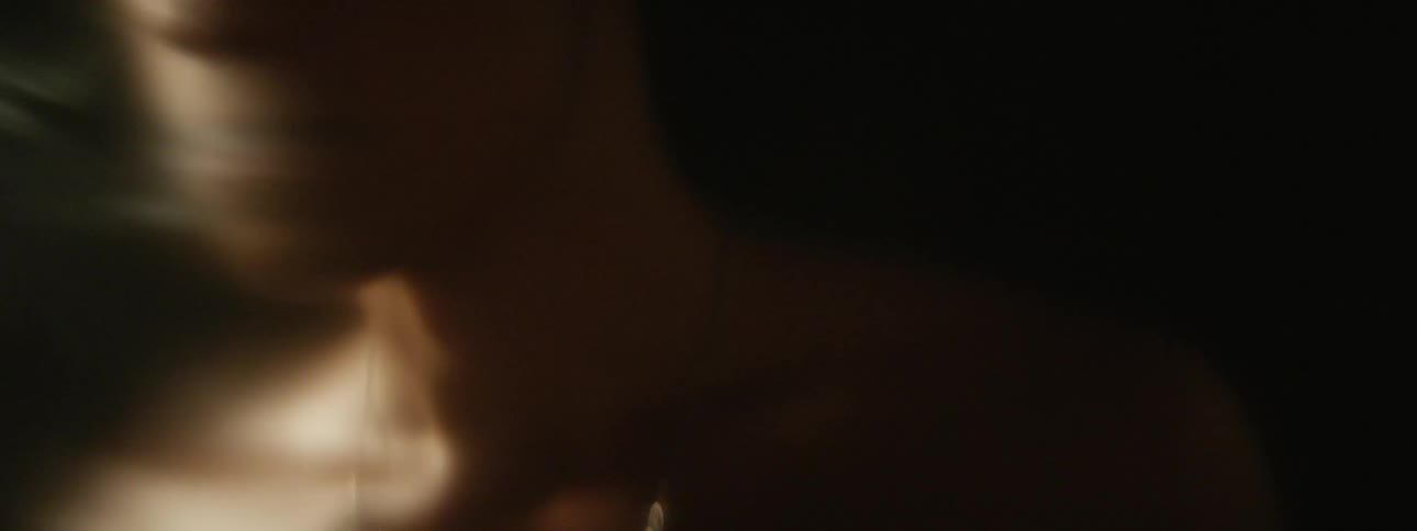 A man standing outside smoking a cigarette