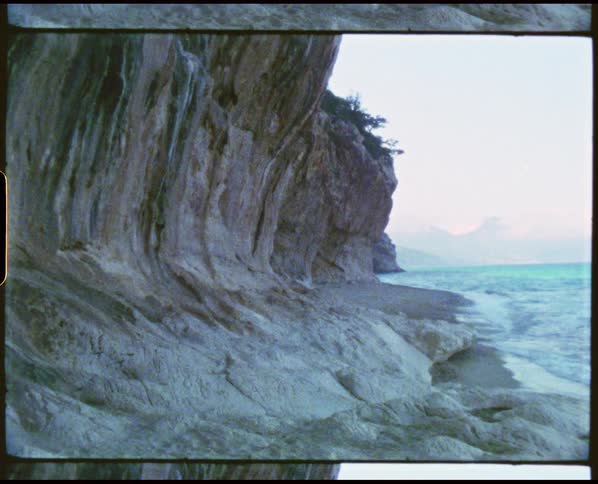 The waves crash against the shore