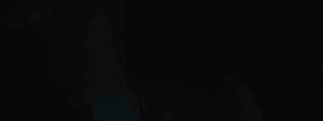 A person in a room with blue lighting