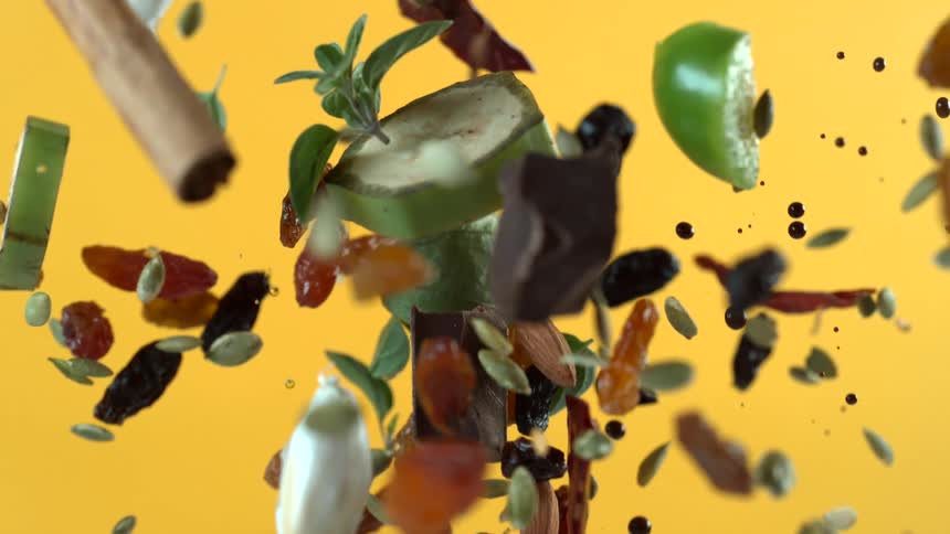A view of food being thrown in the air and falling back down