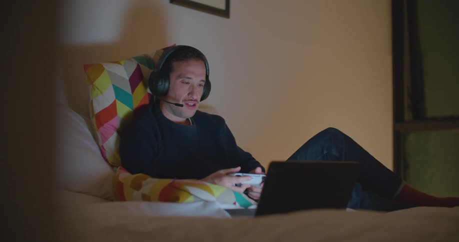 A man speaks animatedly while using voice chat as he plays a video game