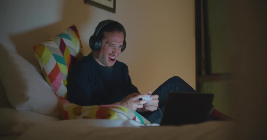 A man playing games on his laptop