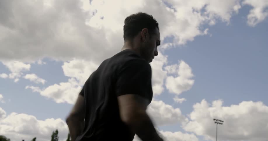 A man in a black shirt runs