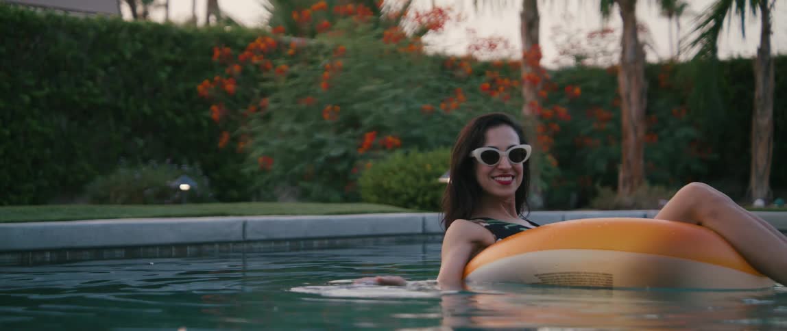 A woman smiling in a pool