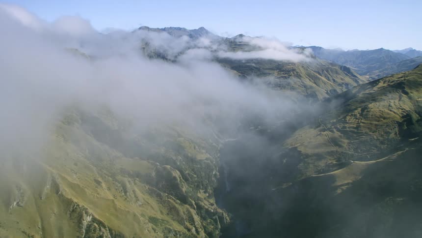Aerial shot of mountains with clouds