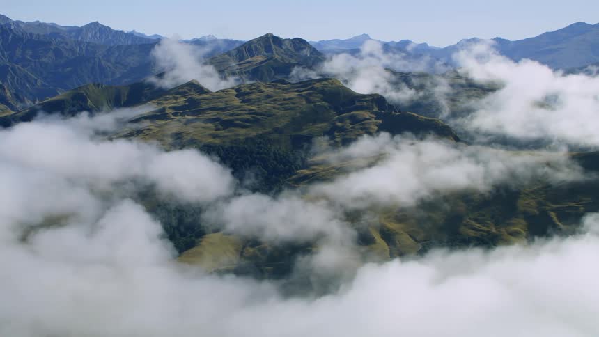 A landscape with cliffs and mountains with the sky and clouds