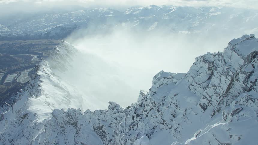 Aerial shot of a snow covered mountain top
