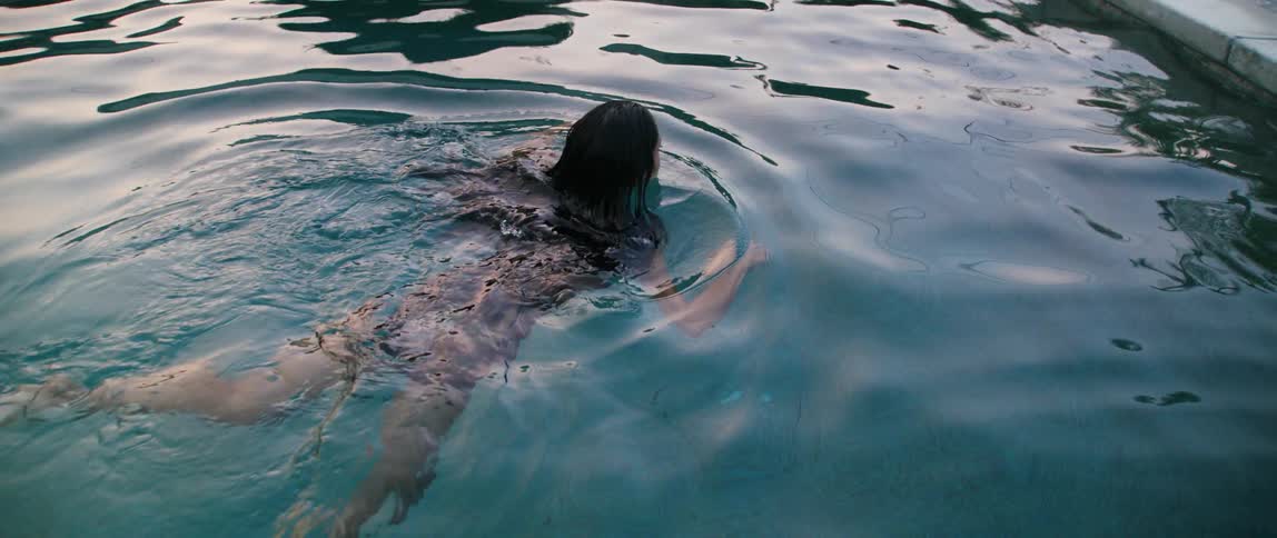 A woman swimming in a pool