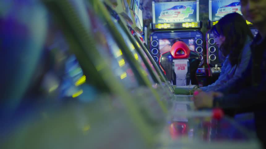 People play games in an arcade