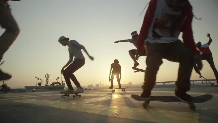 Kids ride their skateboards on the roof