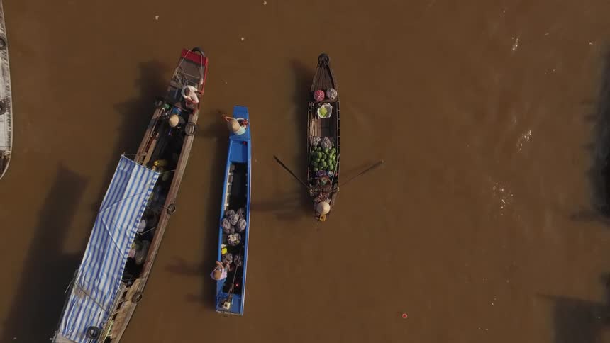 Boats going in a brown lake