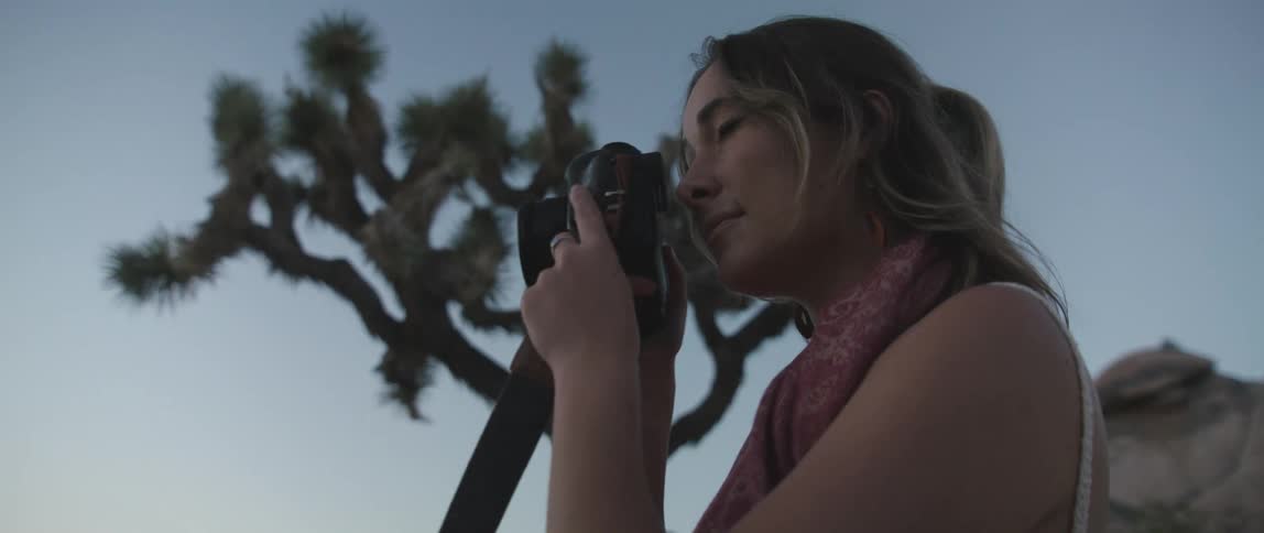 A woman taking photos with a camera