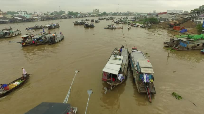 An aerial view of boats on a river