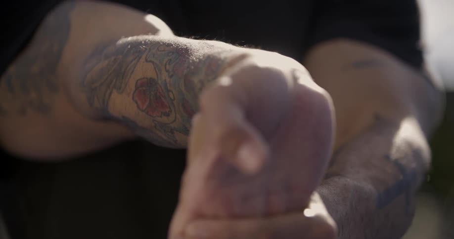 A man stretches the fingers on his hand