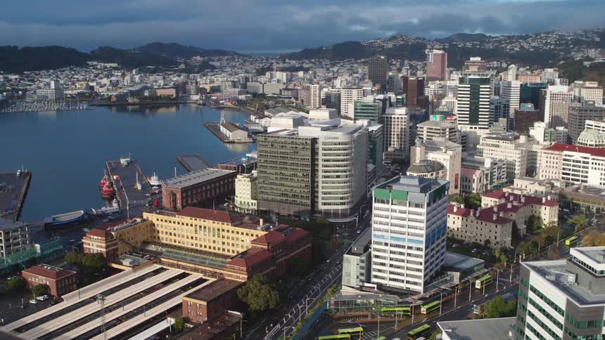 A bay surrounded by tall buildings in a metropolis during the day