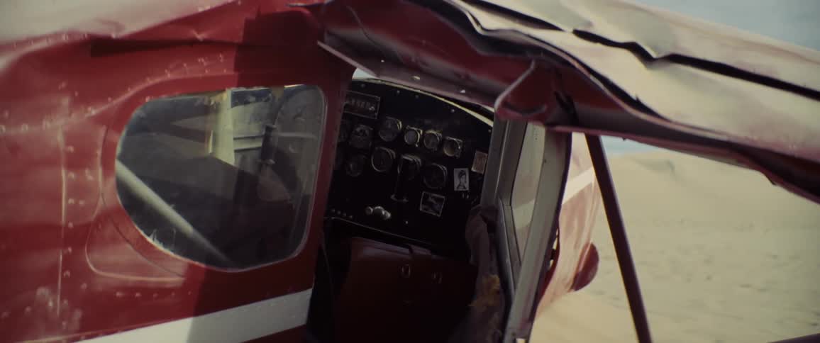 The plane is crashed in the desert and heavily damaged