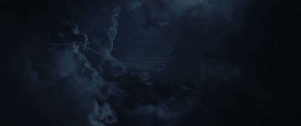 Lightning flashes as an airplane flies in the cloudy night sky