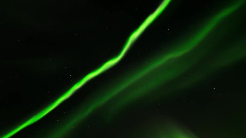 Northern lights twisting straight above in magnetic storm