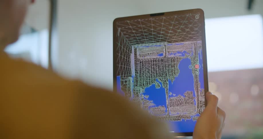 A tablet taking a 3d scan of a room