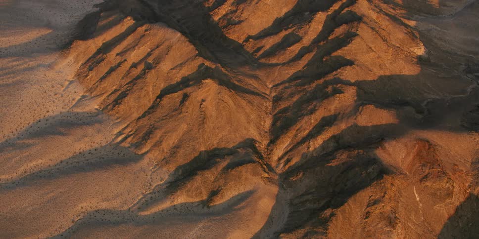 A landscape with mountains and cliffs