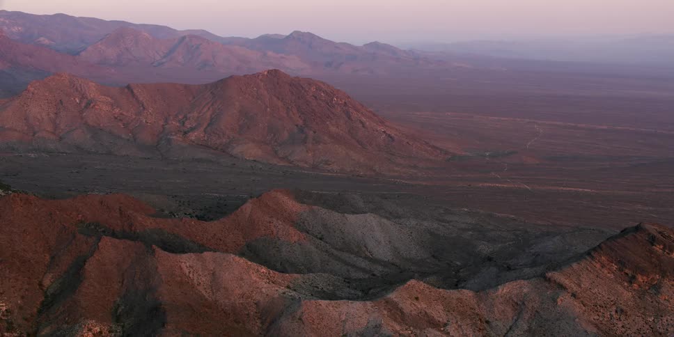 Heavy fog settles over a vast canyon