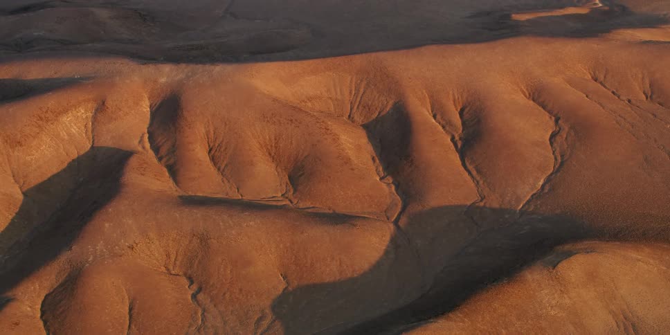 Aerial view of a mountain range on the desert at morning