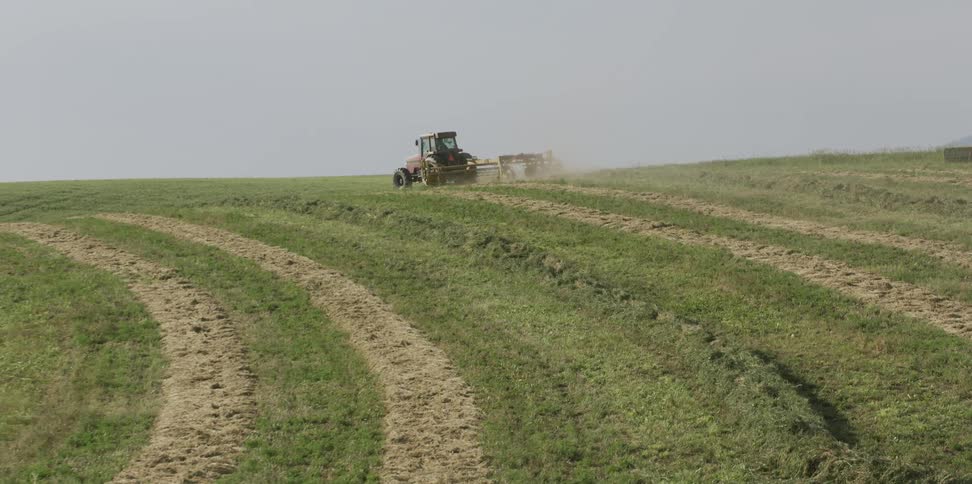 A tractor is working the fields