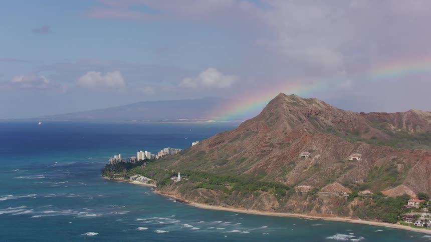 An aerial view of a mountain next to the ocean