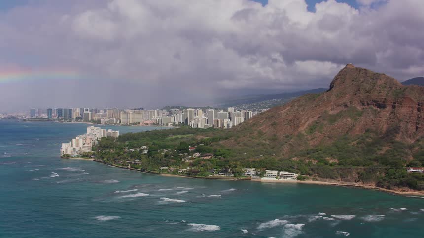 An aerial view of a mountain next to the ocean