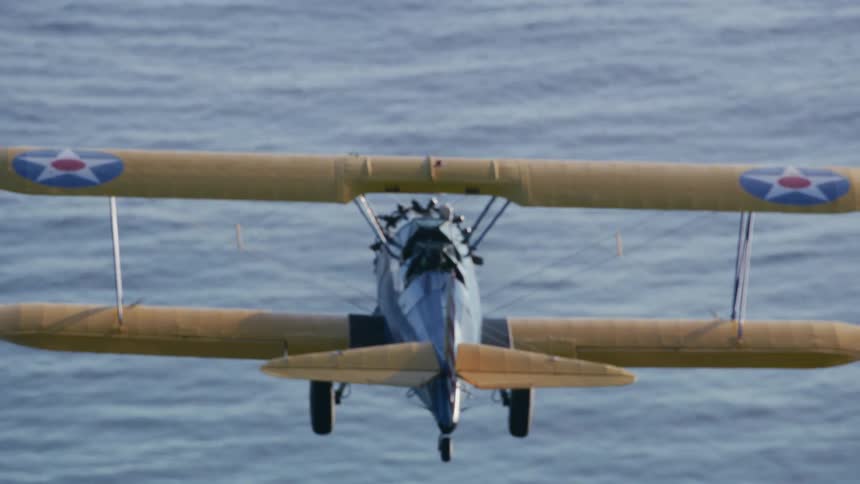 A plane is gliding over the water