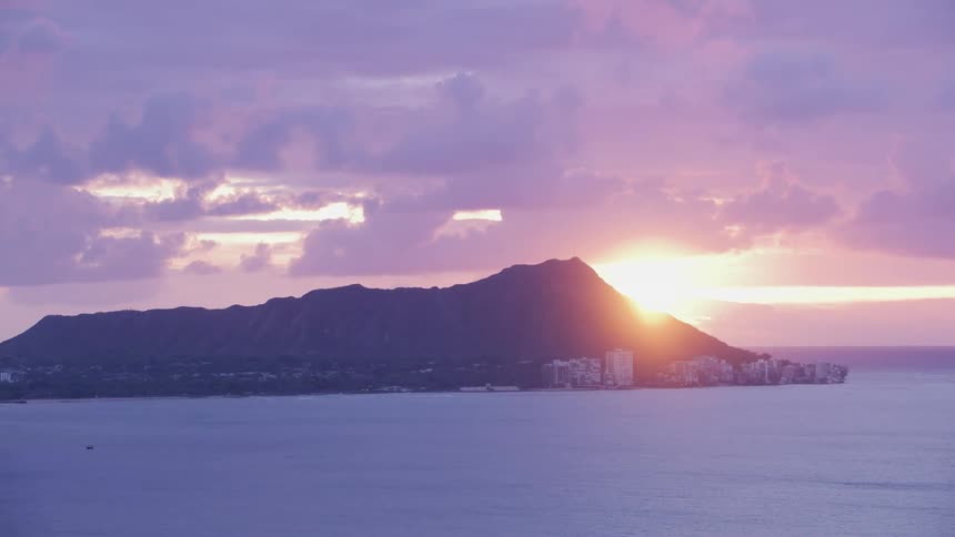 A city near the coast with a cliff sky and clouds in the background