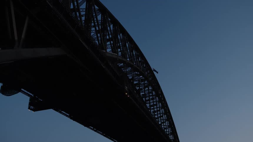 The flag on the bridge is blowing in the wind