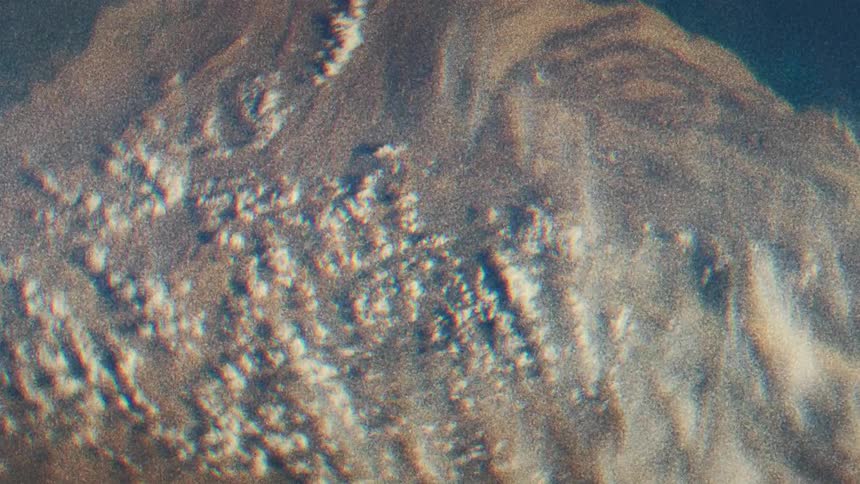 The footage of the land below is blurry