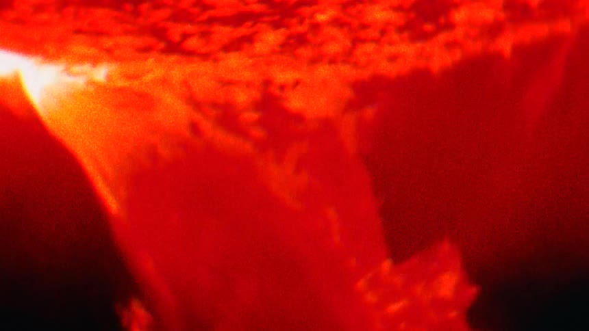 Flame and smoke churn around in the darkness