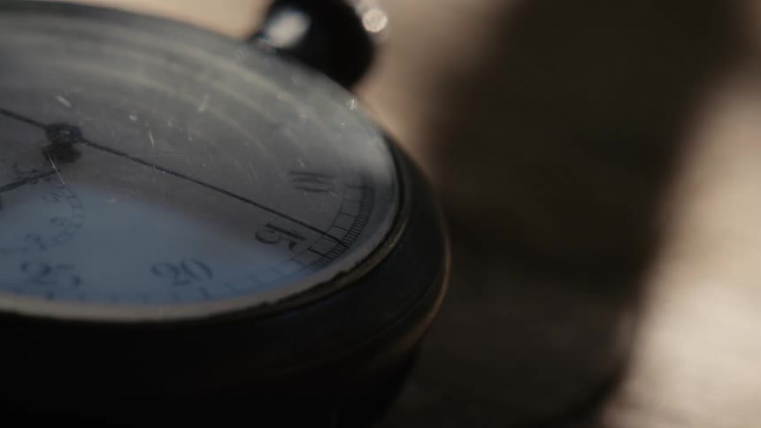 A stop watch is laying on the table