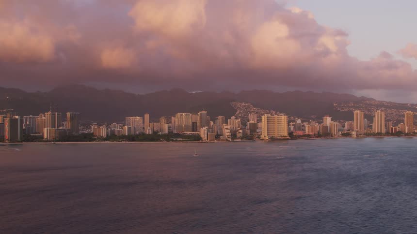 Aerial shot of a city skyline by the ocean
