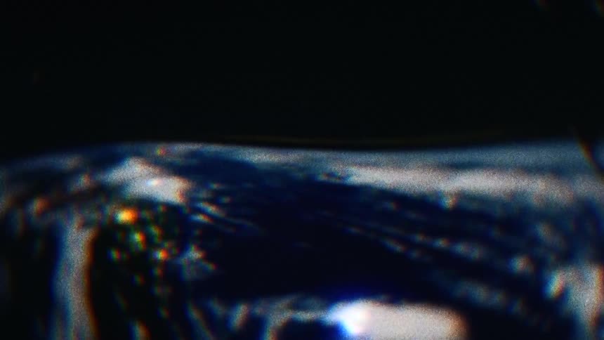 A wave full of water and fire moves along a surface