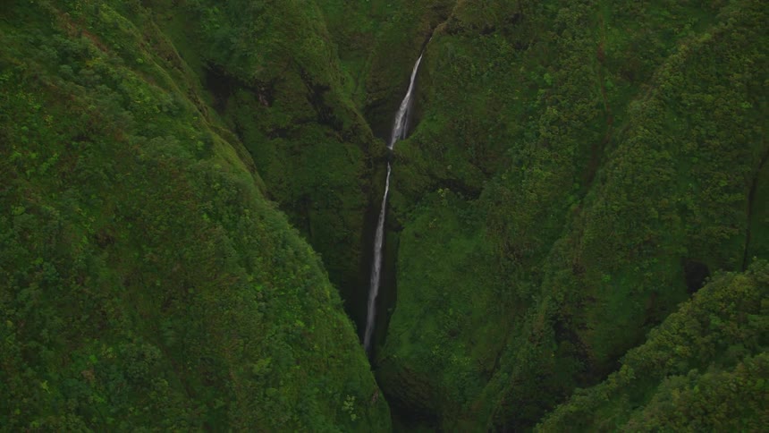 Aerial shot of a waterfall in a hill