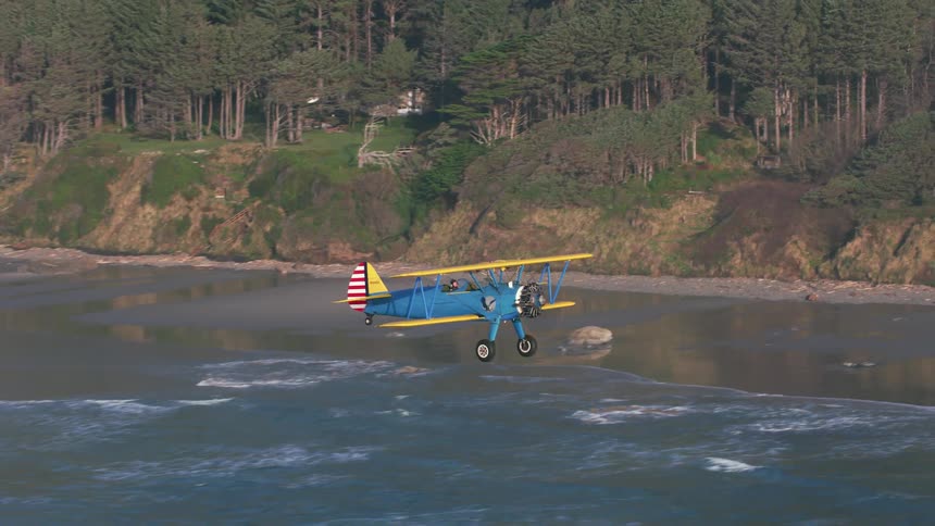 A plane is flying past the island shore