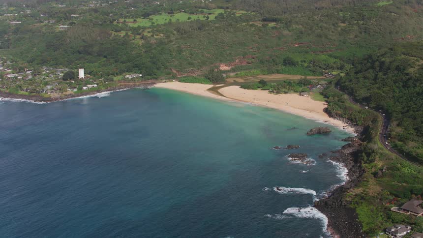 A beach in a bay in a rural area during the day