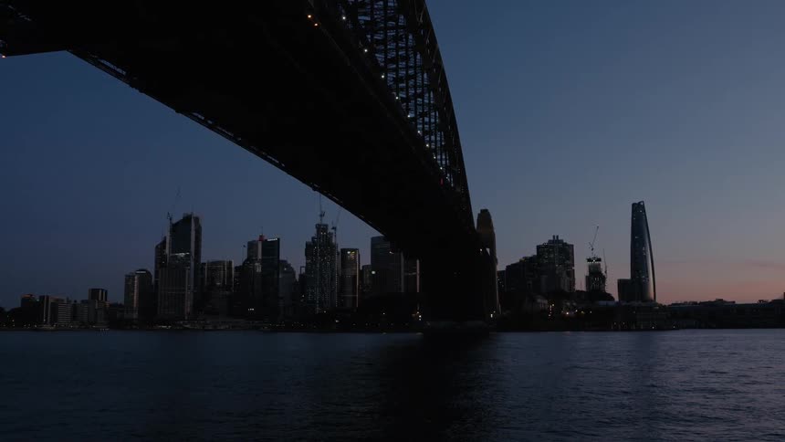 The sun is setting on the large city
