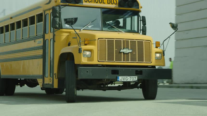 A school bus turns the corner in town