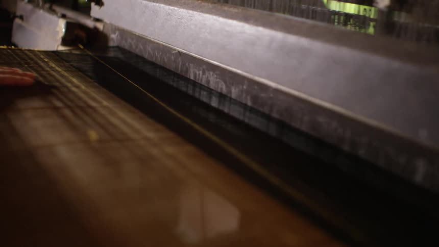 A close up of a weaving machine