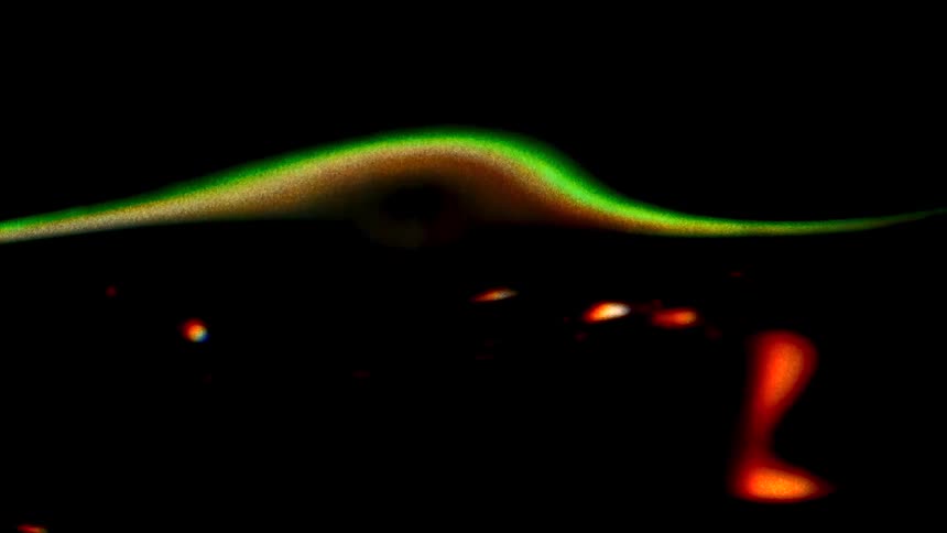 Green black and orange colors that look like water and light