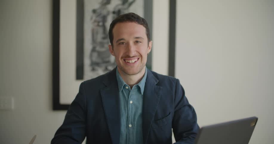 A man laughs in the office