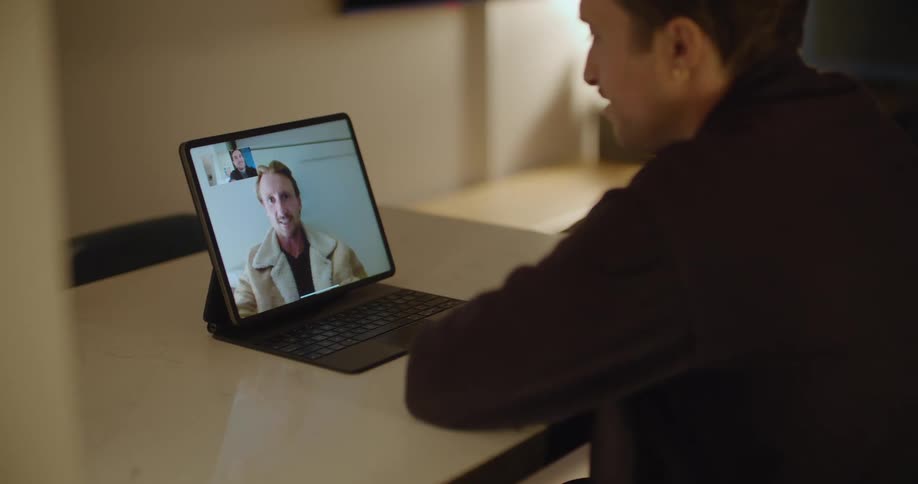 Men are talking on a video conference