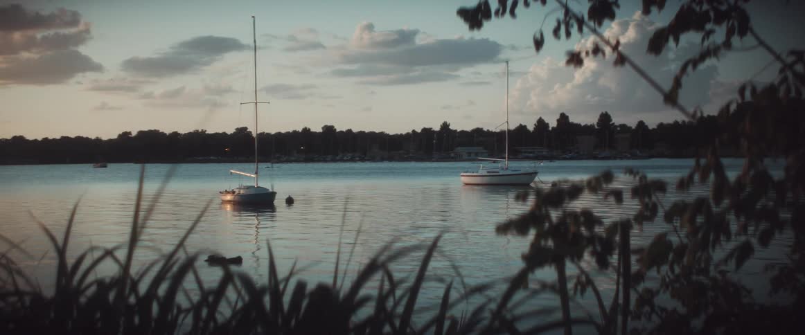 Two boats anchored away from shore